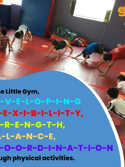 Our classes are designed to develop flexibility, strength, balance, and coordination. This image shows a group of children practicing a bear walk, a full-body exercise.