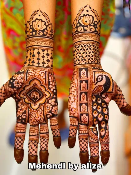 A design that combines peacock and elephant motifs with intricate geometric patterns. The solid fingertips complete the traditional look.