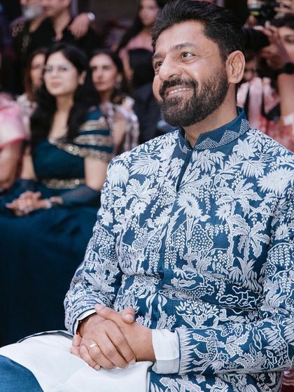 The groom, relaxed and happy, enjoying the performances at his Sangeet. We manage the event flow so the family can sit back and enjoy the show.