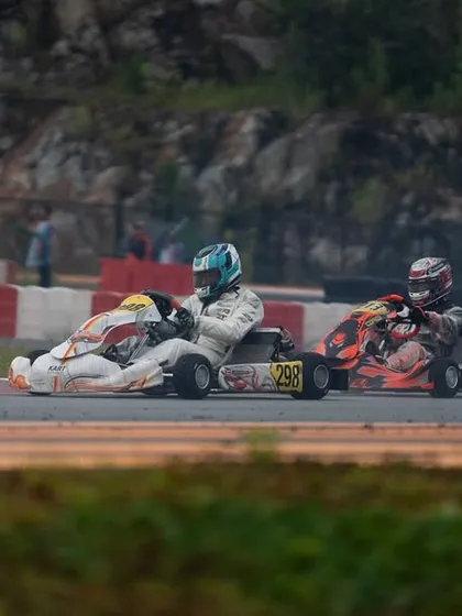 A three-kart battle in the IAME Series Asia, where our driver showcased stellar performance, moving up from P27 to P13.