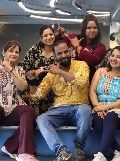A fun, candid group photo from our Janmashtami celebration at the gym.