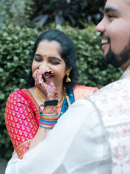 A bride's shy and happy laugh, a beautiful candid moment.