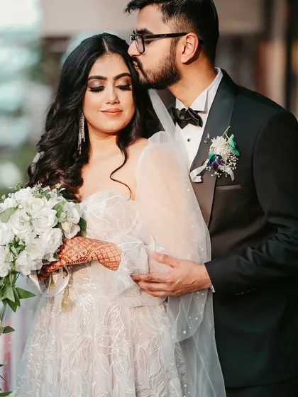 Creating the perfect look for a Catholic wedding ceremony. This bride wanted elegant glam, so I designed a look with a brown smudged kohl eye, flawless skin, and a neutral lip, paired with soft waves to complement her beautiful white gown.