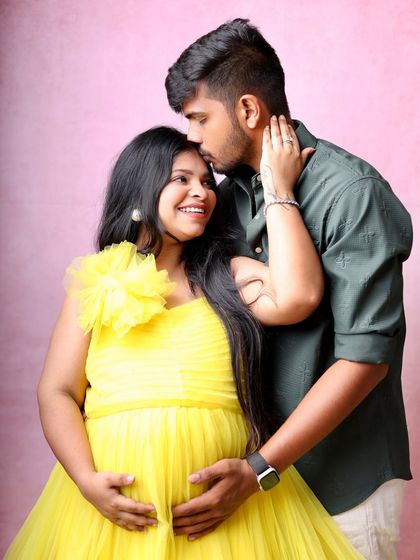 A gentle forehead kiss is a timeless expression of love and protection. This pose is always a favorite during my couple's maternity sessions.