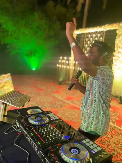 On the mic and connecting with the crowd. This is my favorite part of any gig, making sure the energy is always high and everyone feels like part of the show.