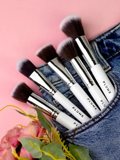 For a fun, casual lifestyle shot, I placed these makeup brushes in the pocket of a pair of jeans. The unexpected combination of beauty tools and denim creates a relatable and modern image.