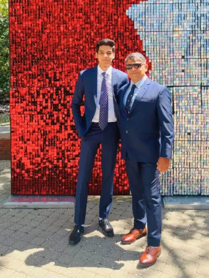 Another shot of two clients in matching navy blue suits. Whether for a corporate event or a family function, my bespoke tailoring ensures a consistent and elegant look.
