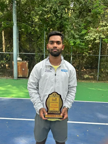 A coach with his runner-up plaque. We believe in leading by example through our own dedication to the sport.