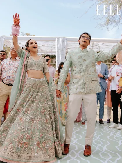 The couple's energy is infectious as they dance during their celebration. We plan events that are full of life and movement.
