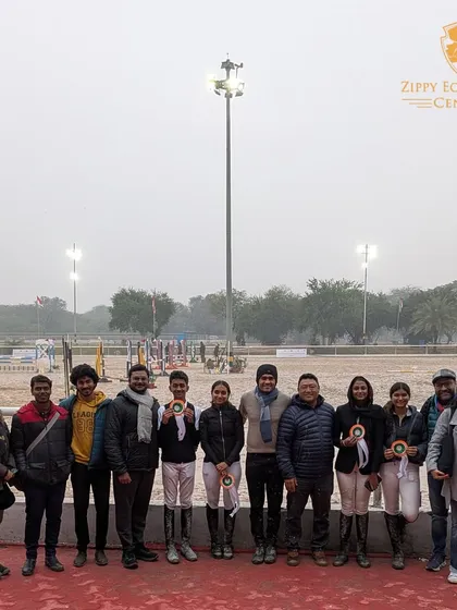 The full team and supporters at the Junior National Equestrian Championship. It takes a village to build a champion.
