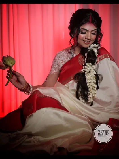 A beautiful, full-length shot capturing the grace and elegance of the traditional Bengali look.