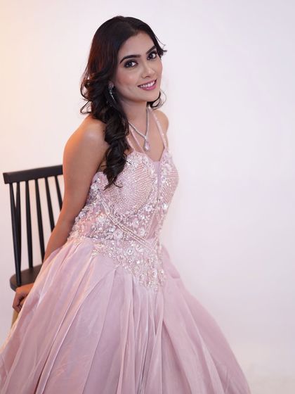 Pretty in pink and glowing with elegance. This is a perfect look for a reception or pre wedding event.