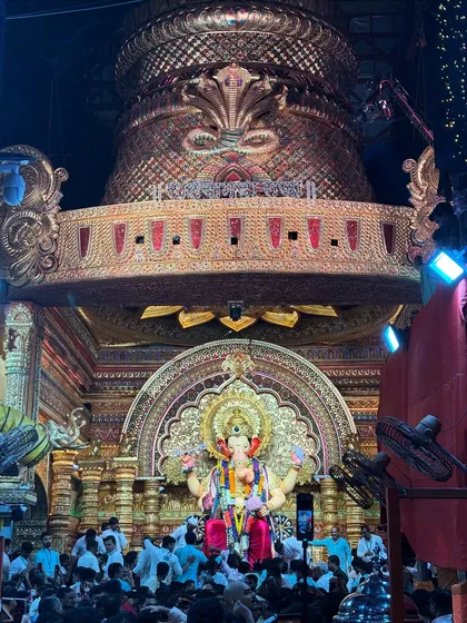 The heart of the celebration: a darshan of the magnificent Lalbaughcha Raja. I focus on capturing the grandeur and intricate details of the idols that are the centerpiece of devotion for millions.