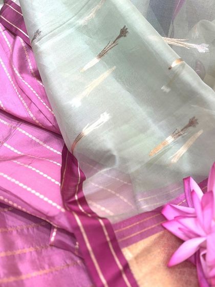 The unique motifs of a Tissue Silk saree. This image displays the delicate, woven patterns on the pallu, showing the artistry involved in creating these feather-light drapes.