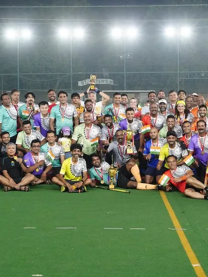 Another celebratory photo from the hockey carnival, with players proudly displaying their medals and trophies. It was a day of great competition and sportsmanship.