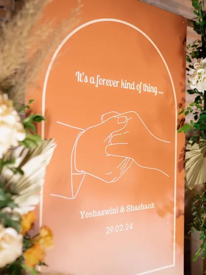 "It's a forever kind of thing." We designed this modern, minimalist welcome sign for Yeshaswini and Shashank, featuring a simple line drawing that beautifully symbolized their decade-long love story.