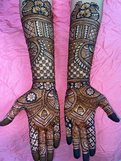 A clear, straight-on view of the peacock and star-flower design, showing its perfect symmetry and intricate detail.