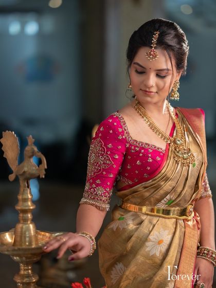 This bride's look is a blend of classic tradition and modern charm. The makeup is kept elegant and understated to let her personality and the beautiful decor shine.