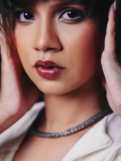 An intense, direct-gaze close-up. This kind of shot is incredibly powerful and perfect for a beauty or headshot portfolio.