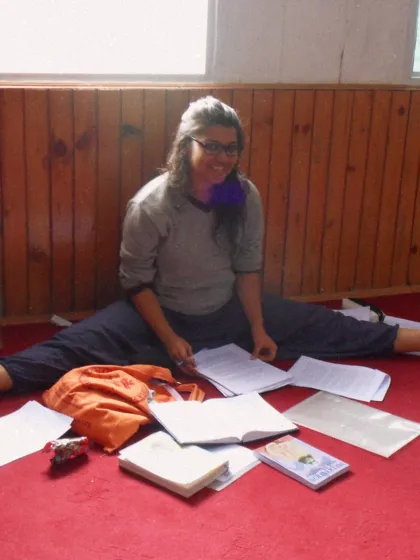 A younger Dyutima during her own TTC, studying with dedication. Every teacher is first a student, and her journey is an inspiration.