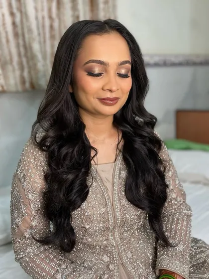 A close-up of the reception makeup. The focus is on the beautifully blended smokey eye and flawless skin.
