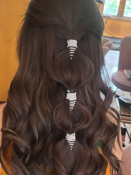 Another view of the bubble half-ponytail with rhinestone cuffs. This style is perfect for a cocktail party or a modern Sangeet look.