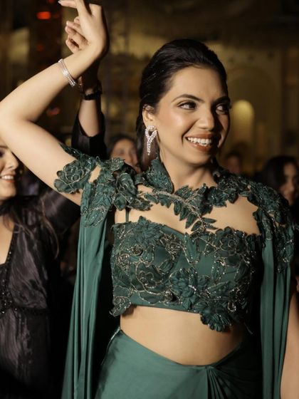 A close-up of the intricate lacework and beading on the shoulder of the gown. It’s these beautiful details that elevate a look from simple to stunning.