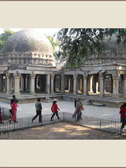 Participants walk past the twin tombs in Hauz Khas village. These walks explore how Delhi's historic villages have navigated the pressures of modern urbanization.