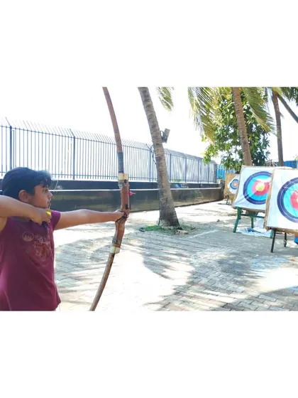 A student at our Dadar range, enjoying the beautiful weather while practicing her archery.