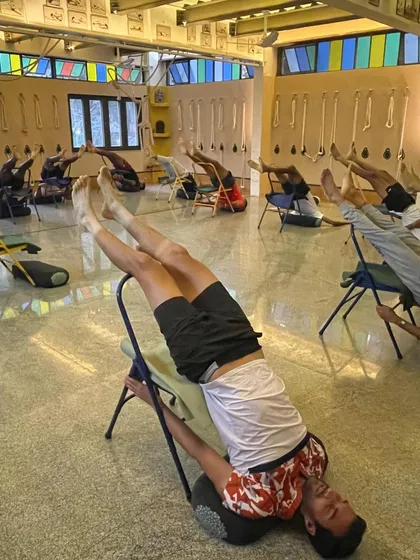 For athletes, recovery is as crucial as training. In this workshop for professional tennis players, we use chairs for a supported Viparita Dandasana, a pose that helps restore energy and release tension in the spine and shoulders. This demonstrates how props make restorative work both deep and accessible.
