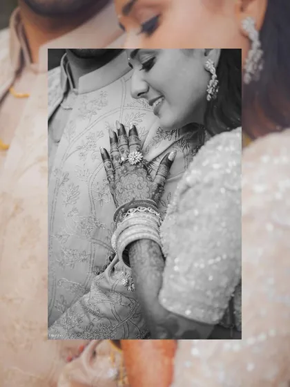 A close-up detail shot focusing on the bride's henna-adorned hand and stunning engagement ring. We believe in capturing the small, significant details that are part of your wedding story.
