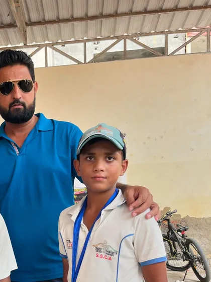 Our coach with Priyanshu Singh. Personal encouragement is a big part of our coaching philosophy.