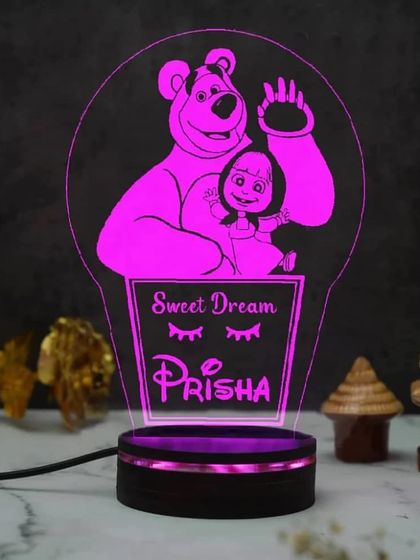 A perfect gift for a child's room, this custom 3D night light features their favorite cartoon character and their name. This "Masha and the Bear" design wishes a sweet dream to Prisha.