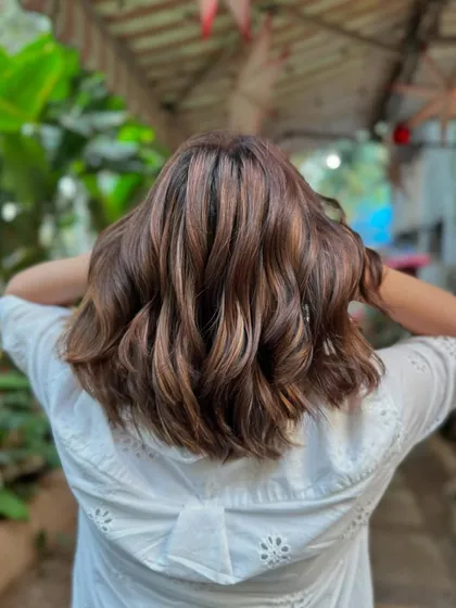 A full back view of the 'Brown Sugar' bob, showing off the beautiful color and fresh cut.