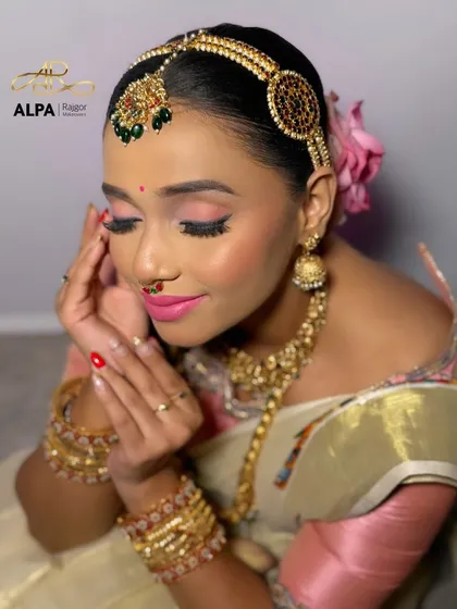 A serene, eyes-closed shot focusing on the soft and blended pink eyeshadow and flawless base.