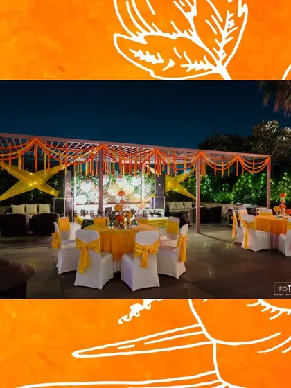 Another view of the outdoor Haldi seating arrangement. The combination of yellow-themed tables and a decorated truss structure creates a vibrant and inviting space for guests.