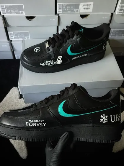 The outer side of the Mercedes F1 custom sneakers, featuring Marriott Bonvoy and UBS logos.