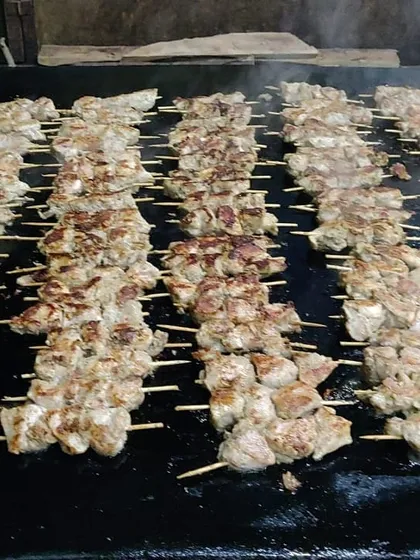 There's nothing like the taste of freshly grilled kebabs. Here are our Malai cheese sticks sizzling on the grill, a popular live counter option that fills the air with an irresistible aroma.
