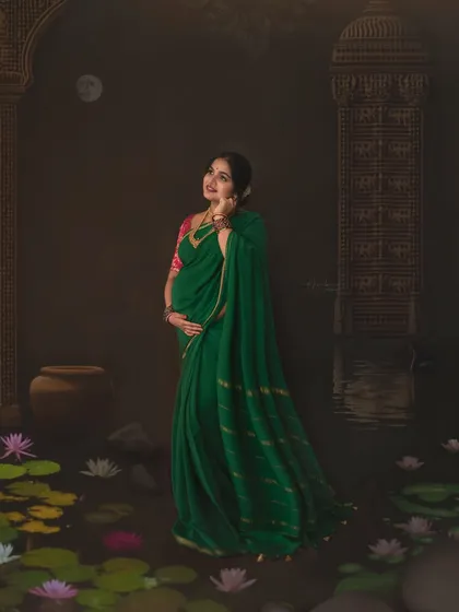 Looking up towards the light, this pose adds a touch of hope and anticipation to the portrait. The combination of the traditional attire and the dreamy, artistic background makes this a truly special fine art maternity photograph.