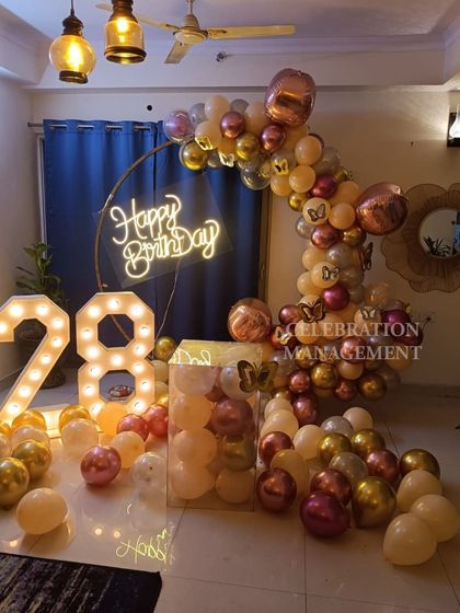 The reflection of the lights on the floor adds an extra layer of magic to this elegant birthday decoration.