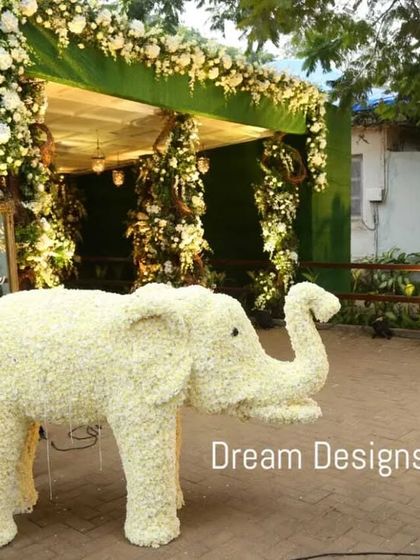 A grand welcome featuring two life-sized elephants made from white flowers. This traditional and auspicious symbol creates an unforgettable first impression for a classic Indian wedding.