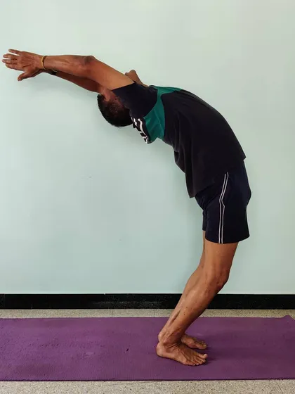 Ardha Chakrasana (Half Wheel Pose). A standing backbend that opens the chest and shoulders and improves spinal flexibility. It is an essential preparation for deeper backbends.