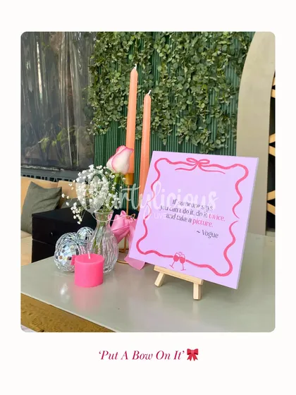 Put a Bow On It. A fun and feminine bridal shower theme, featuring a cute quote sign, pink candles, and bow details.