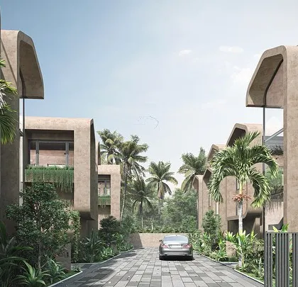 The Vagator Villas are defined by their soft edges and earthy finishes, a design language intended to blend with the Goan outdoors. The curved rooflines and natural materials create a gentle, organic presence in the tropical setting.