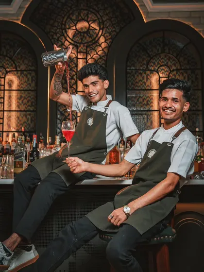 Meet the alchemists behind my bar. They don't just pour drinks; they craft joy, one artisanal cocktail at a time. Their energy and skill are a key part of any celebration at the mansion.