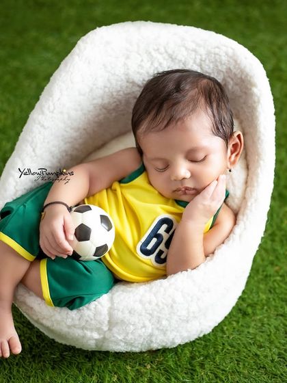 Dreaming of future goals. This little soccer star is resting peacefully after a big game, a creative concept for a sporty family.