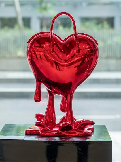 We present 'Melting Affection,' a sculpture that transforms a luxury handbag into a melting, heart-shaped form. It blurs the line between desire, love, and material obsession, asking whether our most cherished treasures are symbols of love, status, or both.
