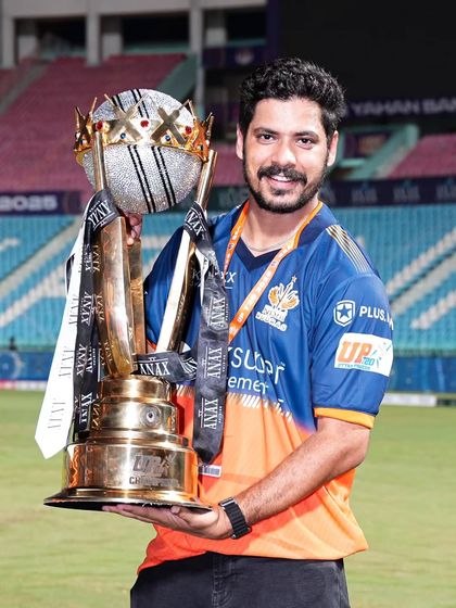 A classic portrait with the prize. Here, a member of the Kashi Rudras poses with the UPT20 trophy on the field, a proud moment captured forever.