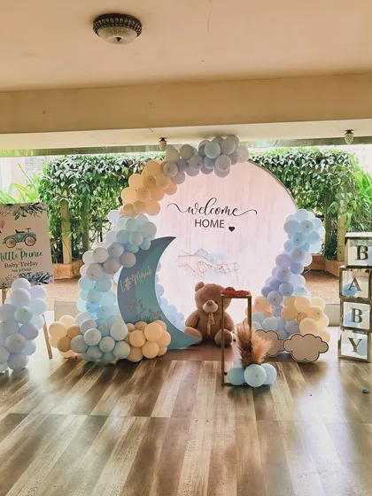 Welcoming a new baby home is such a precious moment. I created this sweet and serene "Welcome Home" setup with a teddy bear and moon theme, using a soft pastel blue and yellow color palette.