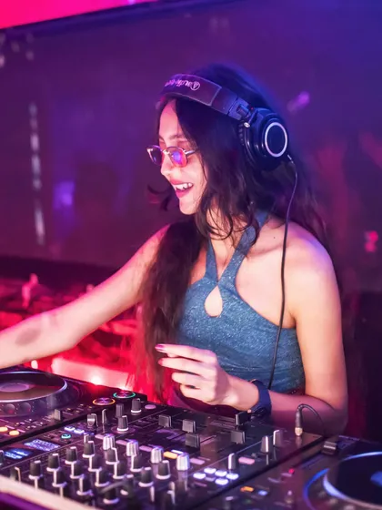 A close-up showing my professional DJ setup with Audio-Technica headphones. I always use top-quality gear to ensure the sound is crisp and powerful, no matter the venue.